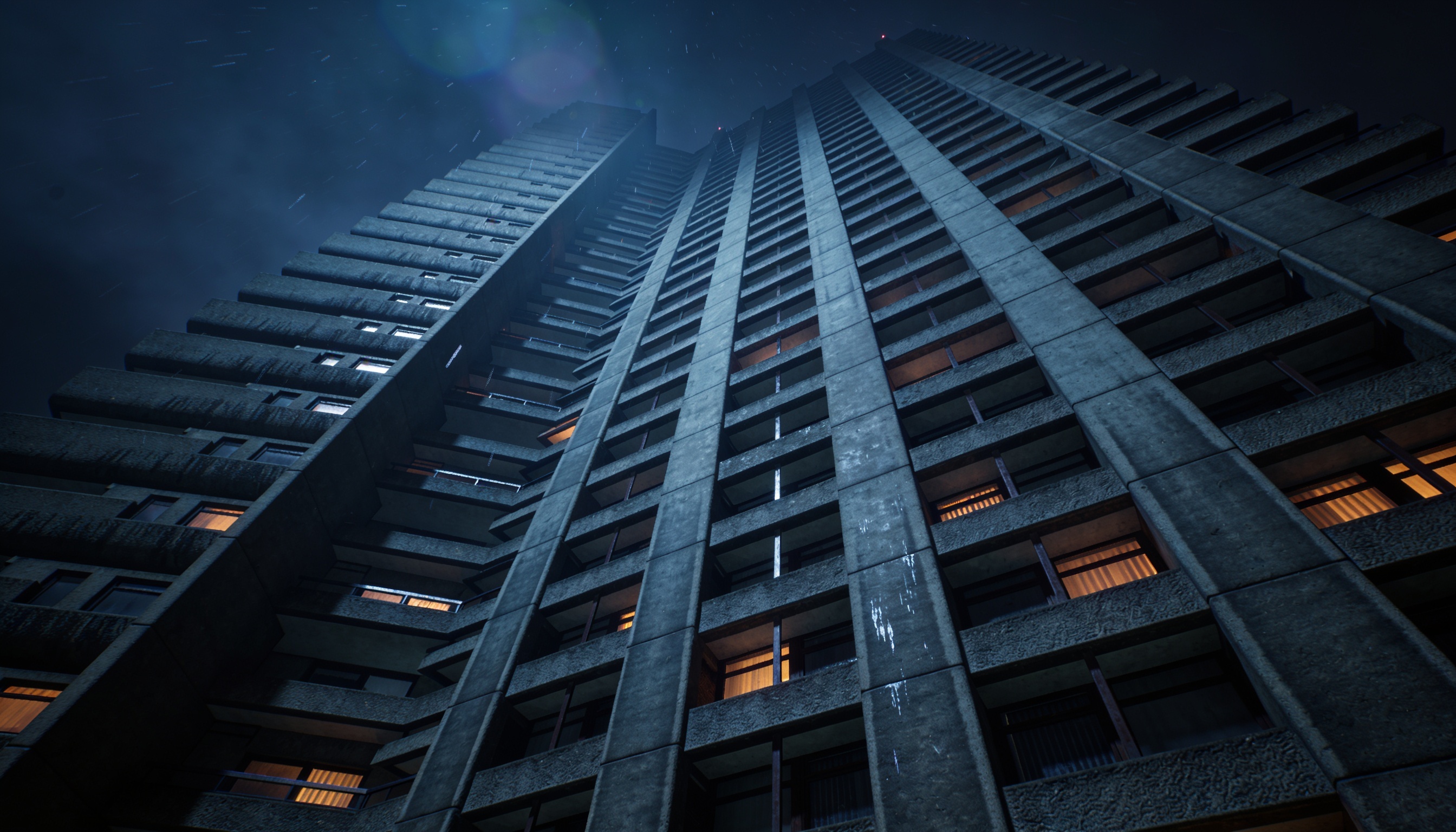 The Slab's tower block seen from below at night